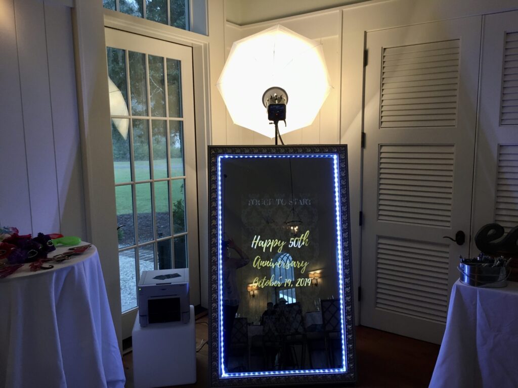 mirror photo booth with personalized message for 50th anniversary celebration