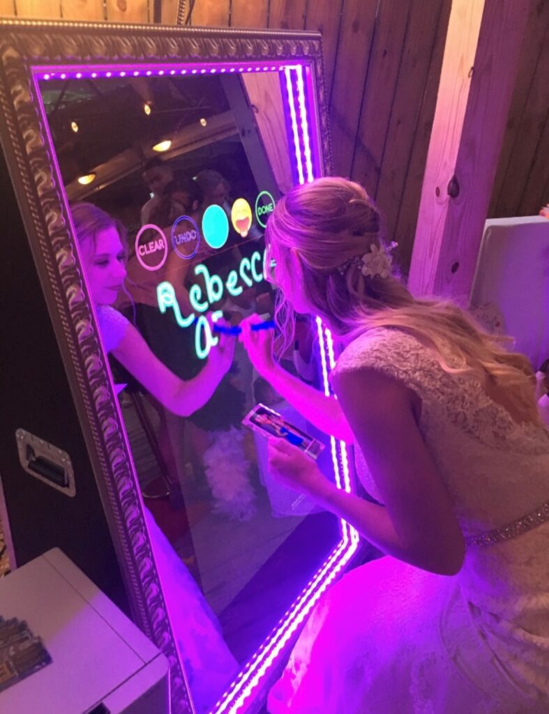 bride writing on touch screen photo booth